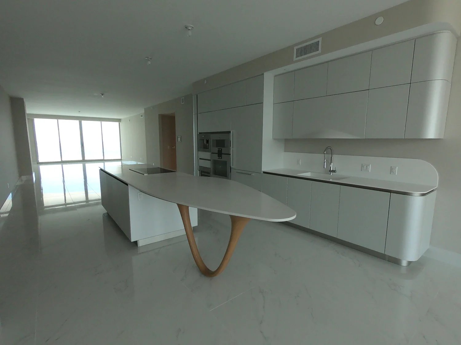 High-end condo kitchen remodel with custom cabinetry and stone countertops — Miami contractor